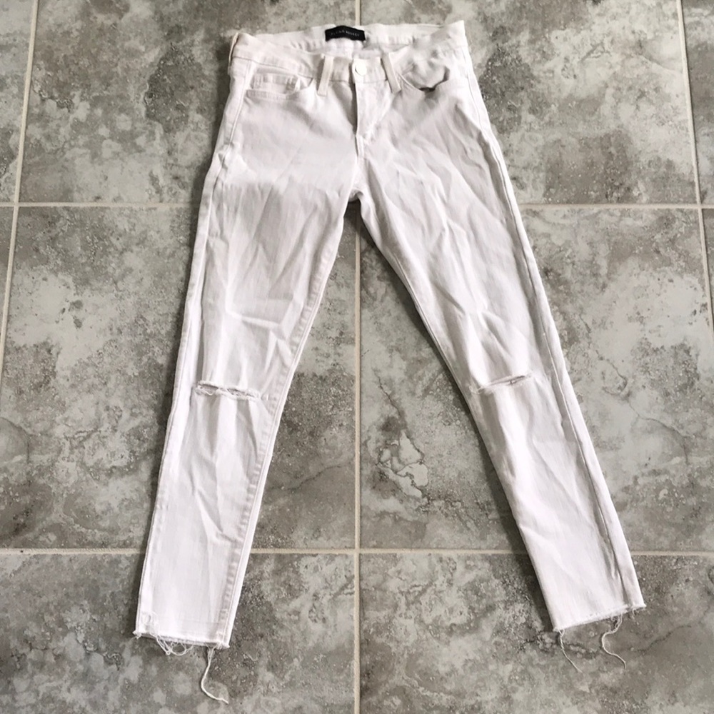 Distressed white skinny jeans